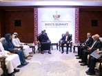 Iranian President Masoud Pezeshkian meets with Crown Prince of Abu Dhabi Sheikh Khaled bin Mohamed bin Zayed Al Nahyan on the sidelines of the BRICS summit in New Delhi.(REUTERS)