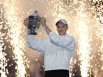 Elena Rybakina of Kazakhstan celebrates with the trophy after defeating Aryna Sabalenka in their Women's Singles Final match on Day Fourteen of the 2026 US Open(Getty Images via AFP)