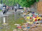 Garbage lying on the roadside at Dugri, Dhandra Road, in Ludhiana on Saturday. (Gurpreet Singh/ht)