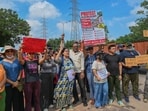 Gurugram, India-September 13, 2026: Residents hold a protest against the illegal dumping of construction and demolition (C&D) waste and garbage along Golf Course Extension Road at sector-66 near IFC signal, in Gurugram, India, on Sunday, 13 September 2026. (Photo by Parveen Kumar/Hindustan Times)