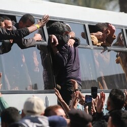 Freed Palestinian prisoners are welcomed by friends and relatives upon arriving at the European Hospital in Khan Yunis in the southern Gaza Strip.