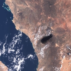This handout satellite image from Copernicus Sentinel Data taken on September 10, 2016, shows black smoke billowing over the desert southeast of Medina along the general route of Saudi Arabia's East-West pipeline (Petroline).