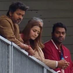 Vijay, Trisha Krishnan and Aadhav Arjuna on stands at Ajith Kumar's Le Mans race.