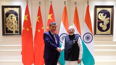 India’s Prime Minister Narendra Modi shakes hands with Chinese President Xi Jinping on the sidelines of the BRICS Summit in New Delh (via REUITERS)