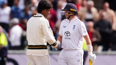 England's Joe Root and Pakistan's Razaullah shake hands following England's victory on day four of the third cricket Test at Edgbaston. (Mike Egerton/PA via AP)
