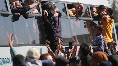 Freed Palestinian prisoners are welcomed by friends and relatives upon arriving at the European Hospital in Khan Yunis in the southern Gaza Strip. (AFP/File Photo) Freed Palestinian prisoners are welcomed by friends and relatives upon arriving at the European Hospital in Khan Yunis in the southern Gaza Strip. (AFP/File Photo)