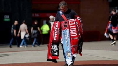 Merchandise for sale outside Old Trafford before the Manchester Derby (REUTERS)