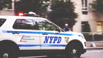 A police officer was dragged to the ground by a BMW that sped away during an attempted traffic stop in New York City's Times Square. (Unsplash)