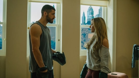 This image released by Prime Video shows Hugo Diego Garcia, left, and Ester Exposito in a scene from the film "Drawn Together." (Prime Video via AP)