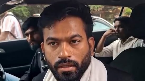 Cockroach Janta Party (CJP) founder Abhijeet Dipke talks to the media as he arrives to visit affected tribal families at a village, in Balaghat district, Madhya Pradesh, Saturday, Sept. 12, 2026.