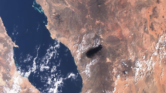 This handout satellite image from Copernicus Sentinel Data taken on September 10, 2016, shows black smoke billowing over the desert southeast of Medina along the general route of Saudi Arabia's East-West pipeline (Petroline).