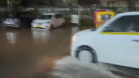 Videos show severe waterlogging near the airport, with cars standing in water as water flows past them.