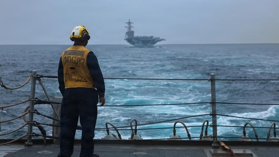 A US Sailor standing on the flight deck of Arleigh Burke-class guided-missile destroyer USS Mason on September 4, 2026.