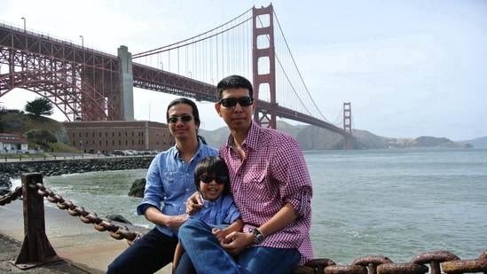 Min Zin, wearing a checked shirt, was born in Myanmar before moving to the U.S.