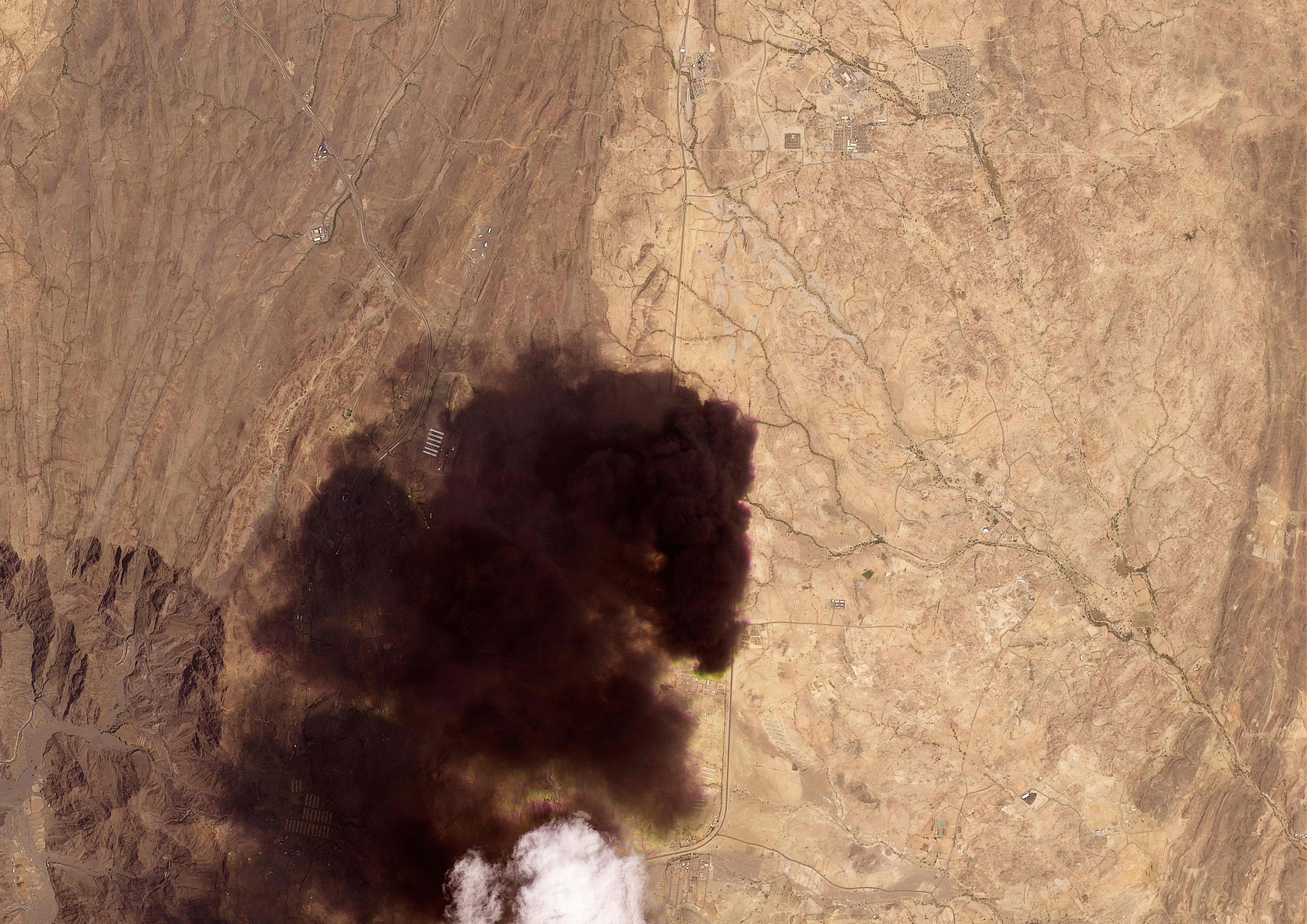 This handout satellite image taken by Planet Labs PBC on September 8, 2026, shows smoke billowing from an Aramco oil depot near the Saudi city of Abha following a Houthi attack. (AFP)