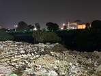 C&D waste lies dumped along the 1090 Crossing-old DG house stretch in Lucknow on Sunday. (Deepak Gupta/HT)