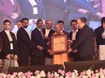 Chief minister Yogi Adityanath, Allahabad high court Chief Justice Arun Bhansali and others at an HCBA event in Prayagraj on Monday. (HT Photo)