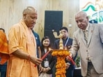 Chief minister Yogi Adityanath and Lokayukta Justice Sanjay Mishra light the ceremonial lamp during the 50th Foundation Day ceremony of the Lokayukta Organisation, in Lucknow on Monday. (ANI PHOTO)