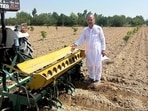 Farmer Ravi Singhmar during a carrot seed sowing exercise in his field in Dharamura, near Abohar, Punjab, on Sunday. (Sanjeev Kumar/HT)