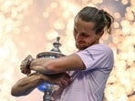 Germany's Alexander Zverev hugs the US Open trophy after defeating USA's Ben Shelton in the men's singles final. (AFP)