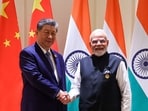 This handout photograph taken on September 12, 2026 and released by the Indian Press Information Bureau (PIB) shows Prime Minister Narendra Modi (R) and China's President Xi Jinping shaking hands during a bilateral meeting on the sidelines of the 18th BRICS Summit at the Bharat Mandapam in New Delhi.