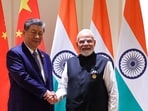 Prime Minister Narendra Modi and China's President Xi Jinping shake hands during a bilateral meeting on the sidelines of the 18th BRICS Summit at the Bharat Mandapam in New Delhi.(AFP)