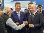 Prime Minister Narendra Modi, Russian President Vladimir Putin and Chinese President Xi Jinping share a moment at Bharat Mandapam, the venue of BRICS Summit in New Delhi, India, September 12, 2026. 