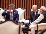 Prime Minister Narendra Modi is seen sitting with Russian President Vladimir Putin and Chinese President Xi Jinping, as they seemingly sip tea together while engaged in a conversation.