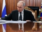 Russian President Vladimir Putin listens to Novgorod Region Governor Alexander Dronov at the Kremlin in Moscow, Monday, Sept. 14, 2026. (Vyacheslav Prokofyev/Sputnik, Kremlin Pool Photo via AP)