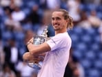 Germany's Alexander Zverev holds the trophy after defeating USA's Ben Shelton in the men's singles final tennis match on day fifteen of the US Open tennis tournament