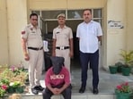 The arrested accused in police custody on Sunday. (HT Photo)