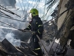 This handout picture taken and released by Ukrainian State Emergency Service on September 12, 2026 shows a firefighter working to put out fire in multi-storey residential building following a strike in the Ukrainian city of Odesa, amid the Russian invasion in Ukraine. Russian missile and drone strikes hit residential buildings overnight in Odesa, destroying entire floors and leaving 35 people injured, regional governor Oleg Kiper said. (AFP)