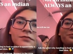 Woman questioning crew about a delayed flight.