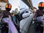 The incident came to light after a video taken from a camera mounted on the two-wheeler being driven by the woman rider went viral.