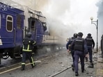 Firefighters extinguish a car of a passenger train hit by a Russian drone strike at a railway station, Lutsk, Ukraine, Sept. 12.