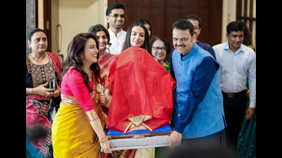 **EDS: THIRD PARTY IMAGE** In this image posted on Sept. 14, 2026, Maharashtra Chief Minister Devendra Fadnavis performs Ganesh Sthapna puja with family members on the occasion of Vinayaka Chavithi, in Mumbai, Maharashtra. (@Dev_Fadnavis/X via PTI Photo)(PTI09_14_2026_000127B) (@Dev_Fadnavis)