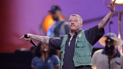 Macklemore’s “Free Palestine” comments at Ed Sheeran’s US tour dates sparked backlash. (REUTERS)