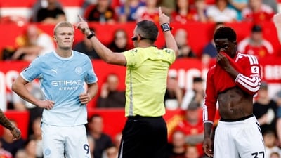 Erling Haaland reacts as referee Michael Oliver awards their first goal following a VAR review. (Action Images via Reuters)