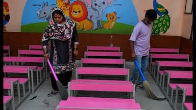 Sweepers cleaning the premises of a govt school in Ludhiana on Monday. (HT Photo) Sweepers cleaning the premises of a govt school in Ludhiana on Monday. (HT Photo)