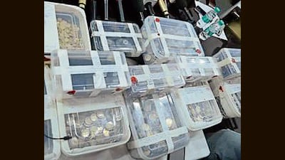 The boxes of coins seized by Saharanpur police. (HT Photo)