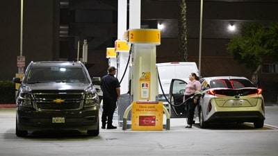 Drivers fill their vehicles with gasoline in Los Angeles, California. (AFP)