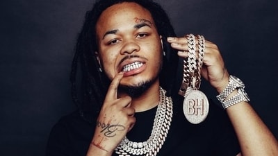 Chicago rapper BloodHound Q50, 22, was shot and killed in an early-morning incident. Multiple assailants fired from two cars, with Cooper sustaining fatal injuries. Chicago rapper BloodHound Q50, 22, was shot and killed in an early-morning incident. Multiple assailants fired from two cars, with Cooper sustaining fatal injuries.