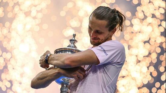 Germany's Alexander Zverev hugs the US Open trophy after defeating USA's Ben Shelton in the men's singles final. (AFP)
