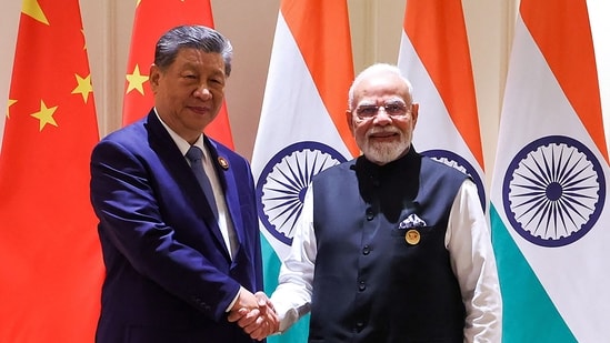 Prime Minister Narendra Modi and China's President Xi Jinping shake hands during a bilateral meeting on the sidelines of the 18th BRICS Summit at the Bharat Mandapam in New Delhi.