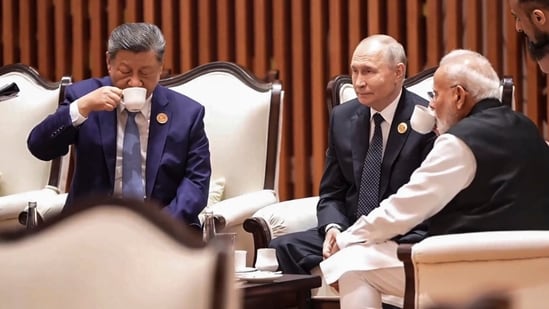 Prime Minister Narendra Modi is seen sitting with Russian President Vladimir Putin and Chinese President Xi Jinping, as they seemingly sip tea together while engaged in a conversation. (Handout)