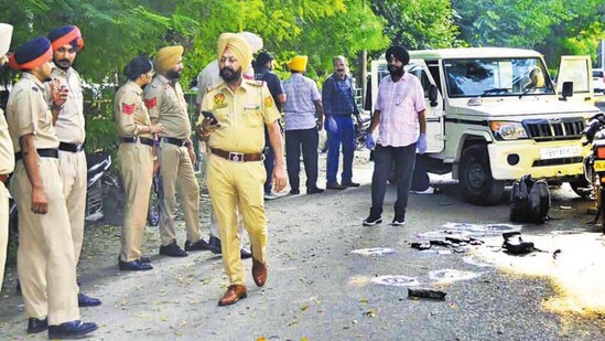 Police personnel on the spot after the encounter. (Gurpreet Singh/HT Photo)