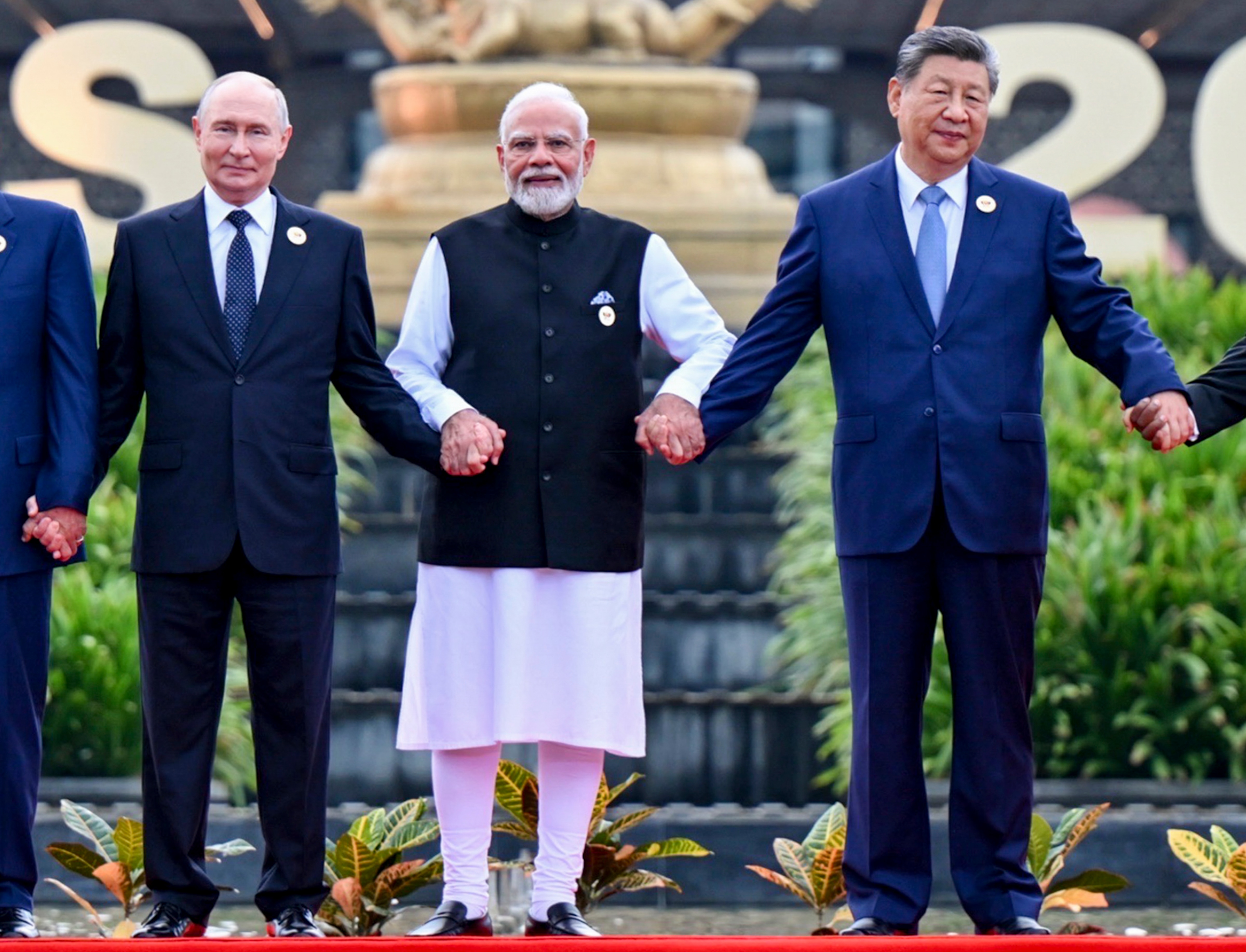 Russian President Vladimir Putin, Prime Minister Narendra Modi and Chinese President Xi Jinping pose for a group photograph at 18th BRICS Summit, in New Delhi. (PTI)