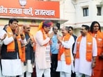 Rajasthan Chief Minister Bhajanlal Sharma greets state BJP President Madan Rathore as they celebrate the results of the Rajasthan Civic Polls 2026  at the BJP office, in Jaipur.