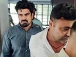 Dausa [Rajasthan], Sep 15 (ANI): The accused driver, Kalyan Bainsla (L), arrested by the Gurugram Police in connection with the hit-and-run case of a female biker on Gurugram's Golf Course Road, in Dausa on Tuesday. (ANI Video Grab)