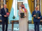 Turkish President Recep Tayyip Erdogan, Saudi Crown Prince Mohammed bin Salman and Pakistani Prime Minister Shehbaz Sharif pose after signing a trilateral defense agreement in Mecca, Saudi Arabia.(AP)